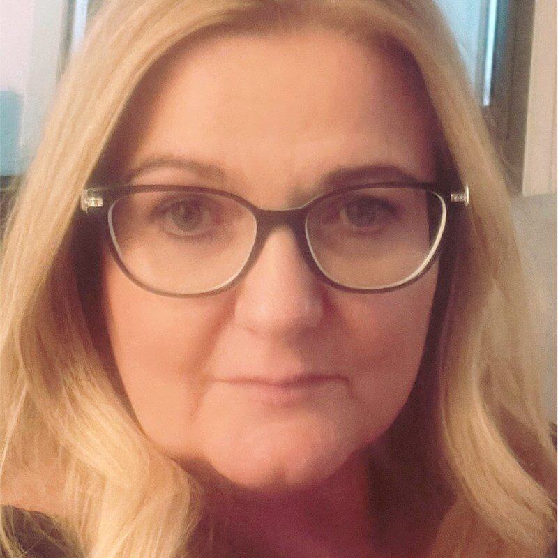 A close up of a person wearing glasses